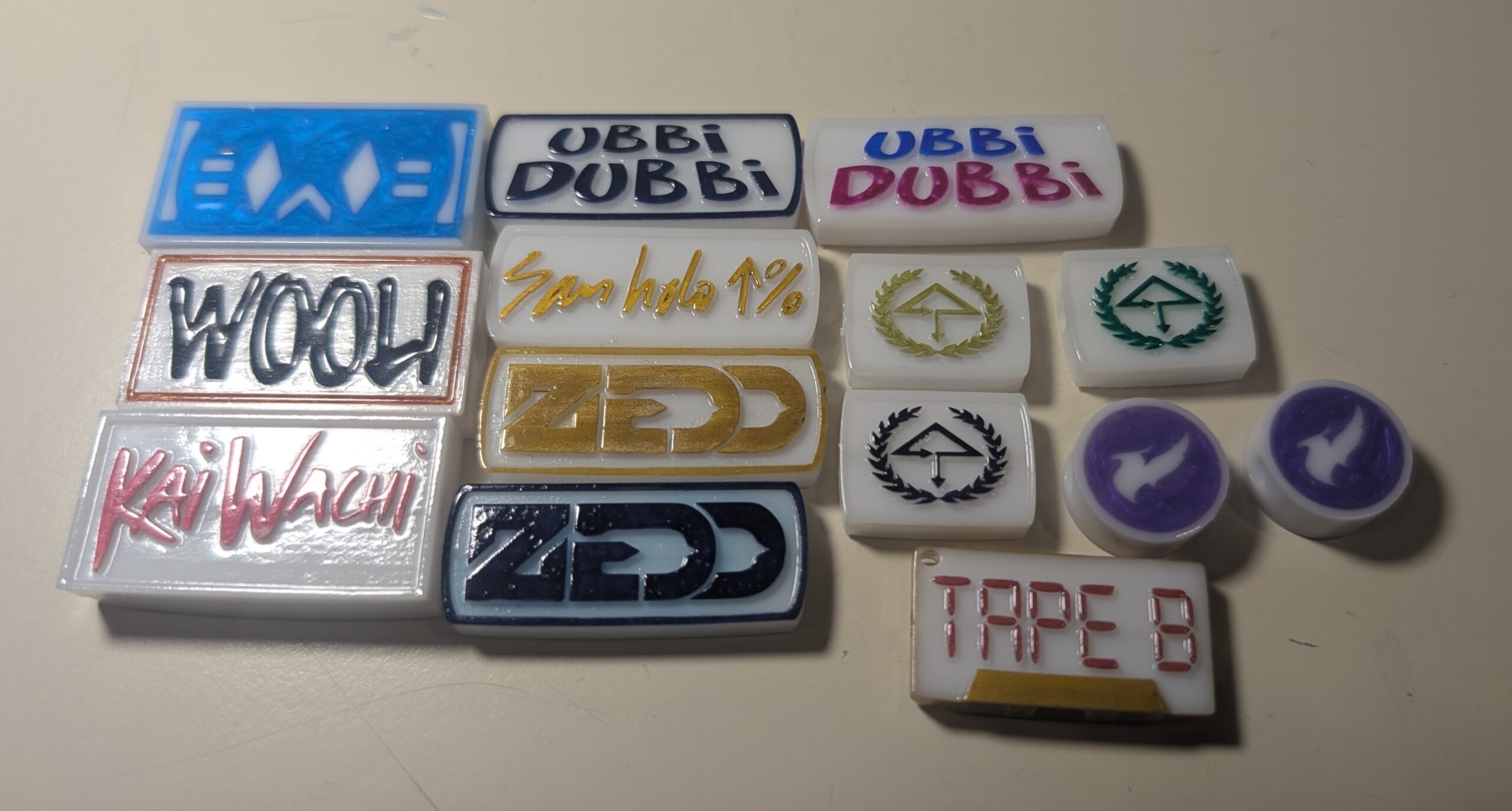 Collection of refined white charms with colorful DJ and festival designs